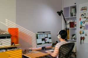 A person attends a virtual meeting on a computer.